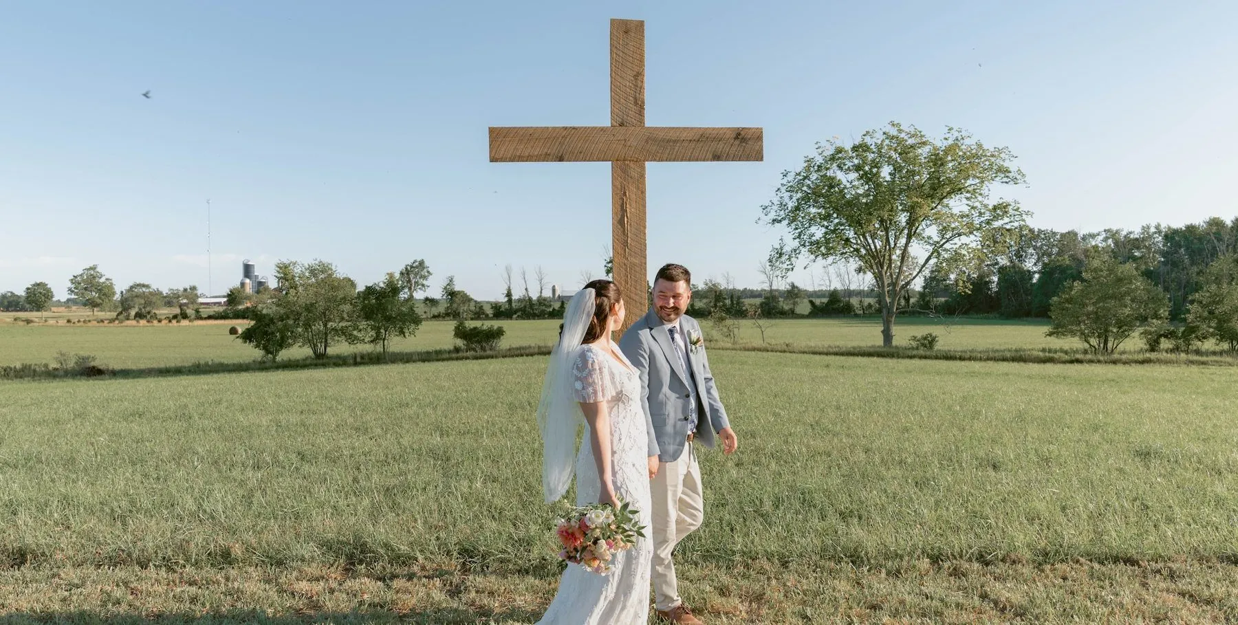 Collin and Mae standing in a pasture